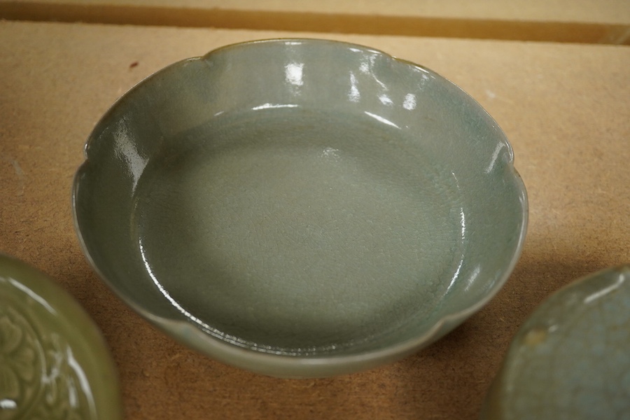 A Chinese celadon glazed box and cover and two similar bowls, largest 15cm diameter. Condition - varies